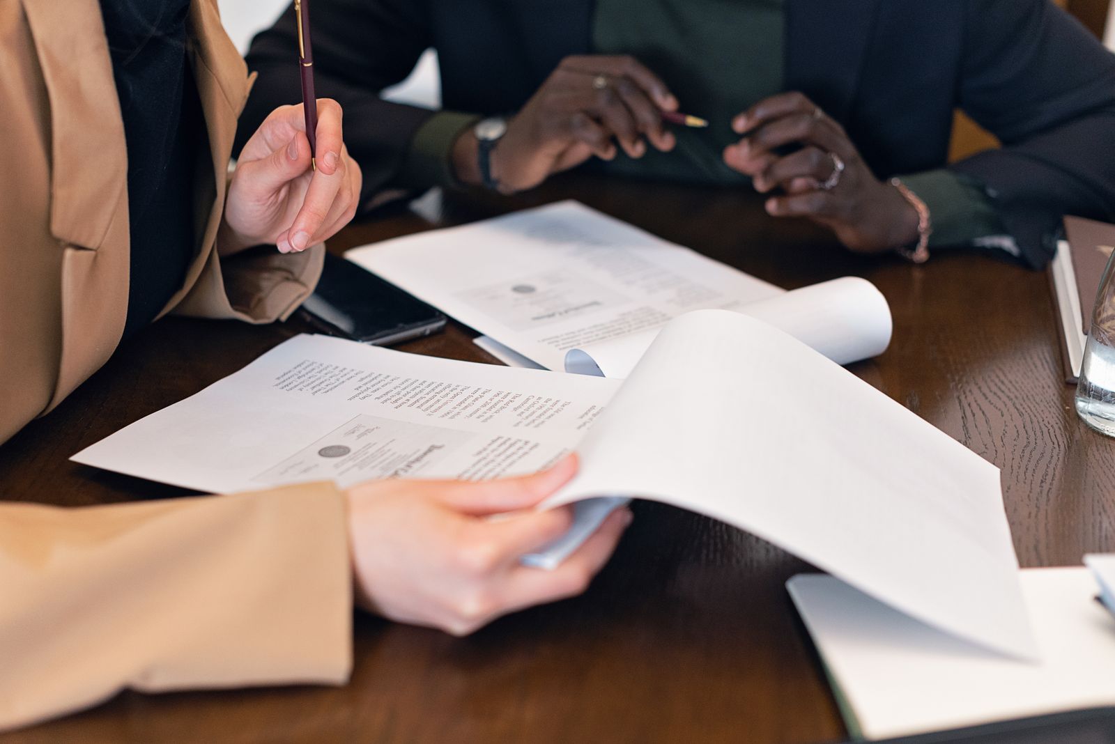 Close-up of hands reviewing business documents